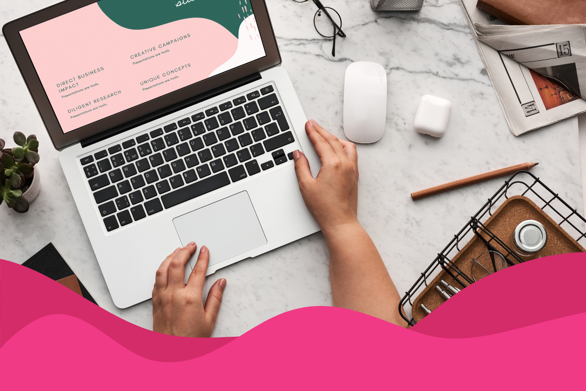 Image of a woman creating a digital marketing strategy on her laptop with mouse and other desk accessories nearby in an article about how to create a digital marketing strategy in 2026 for UK small businesses.