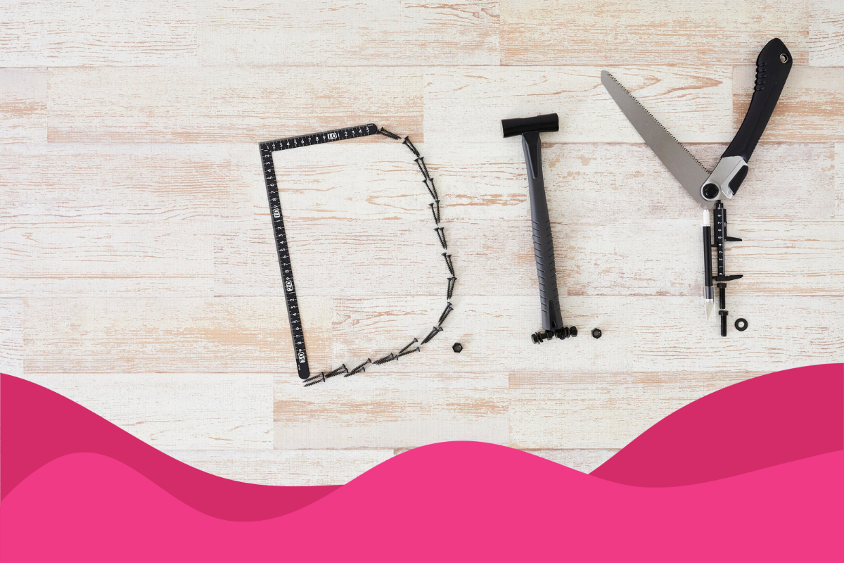 Image of a wooden floor with DIY written with tools in an article about when to outsource digital marketing from DIY by Daffodil Marketing in Sheffield, South Yorkshire.